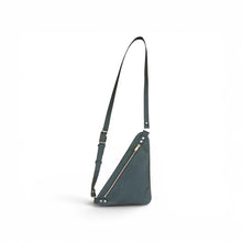 Load image into Gallery viewer, Triangle shaped leather crossbody travel bag with a secure brass zippered closure, cell phone pocket and adjustable shoulder strap with brass buckle. Compact, hands-free design. Flat bag that lays flat against the body. Meant to carry a small wallet, keys and cell phone. Aniline green smooth grain leather that will darken and soften overtime.  

