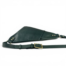 Load image into Gallery viewer, A dark green leather crossbody bag with cell phone pocket and a matching adjustable strap and solid brass buckle, displayed on a clean white background.
